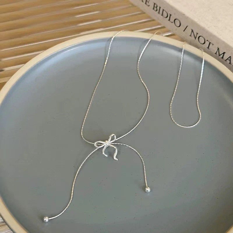 Women's Long Bow Tassel Necklace
